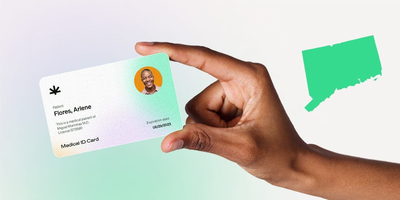 closeup hand holding MMJ card