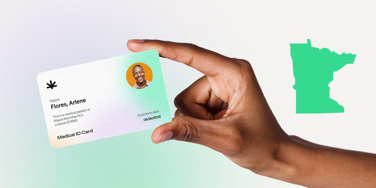 closeup hand holding MMJ card