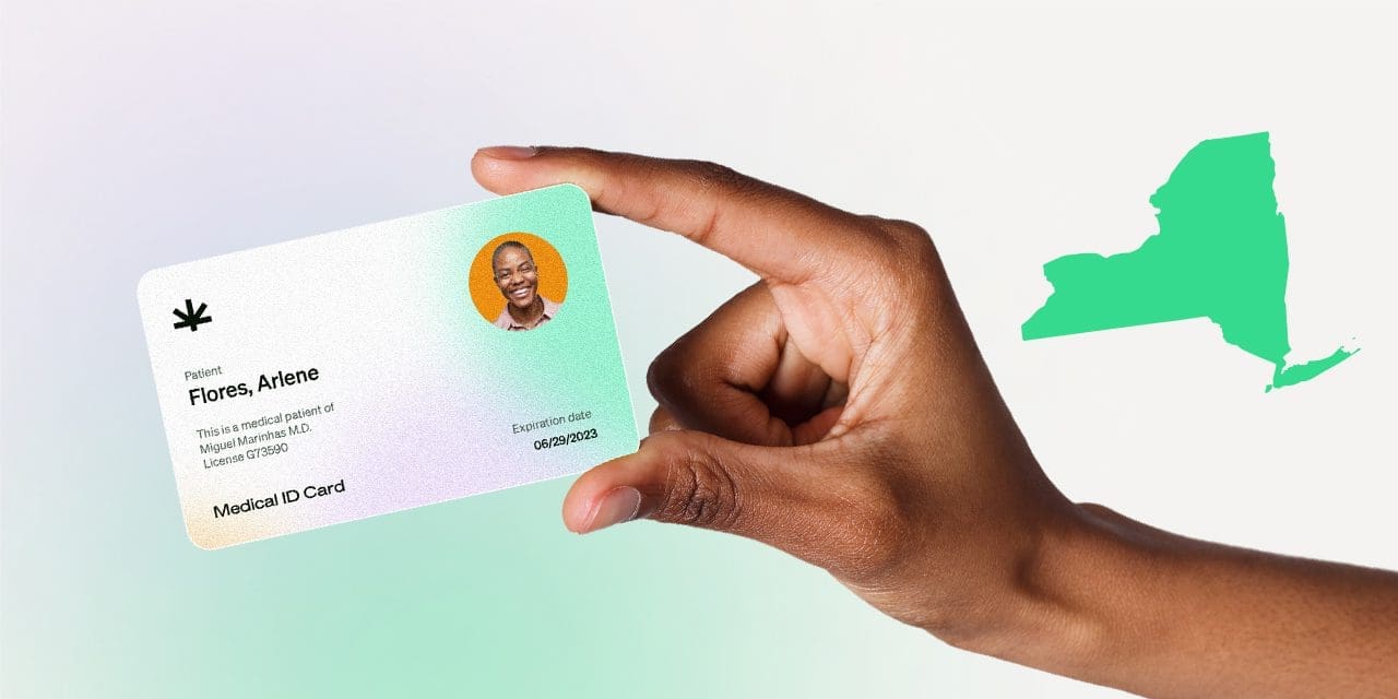 closeup hand holding MMJ card