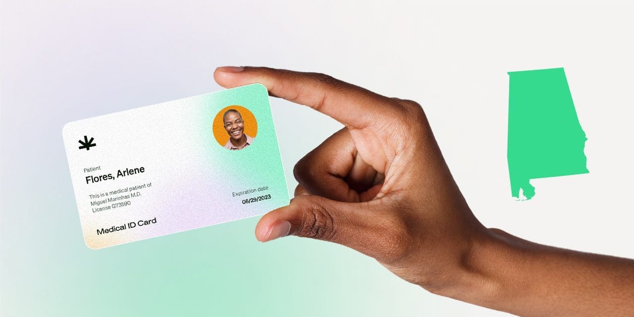 closeup hand holding MMJ card