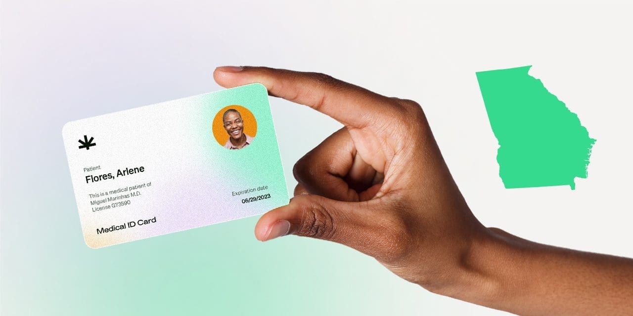 closeup hand holding MMJ card