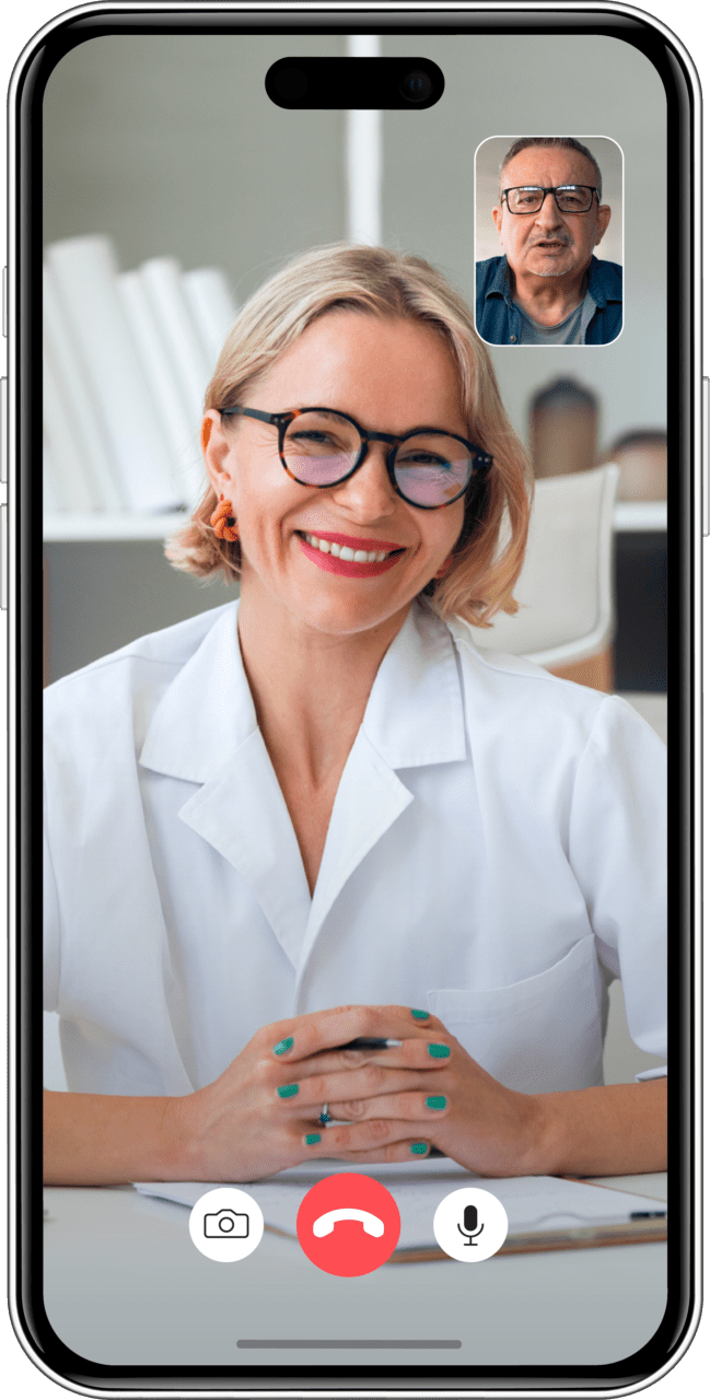 Smartphone mockup of a telehealth call between a male doctor on the main screen and a patient, whose face appears in the upper right corner of the screen