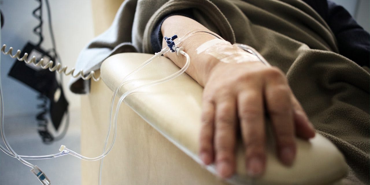 closeup of patient's arm with IV insertions