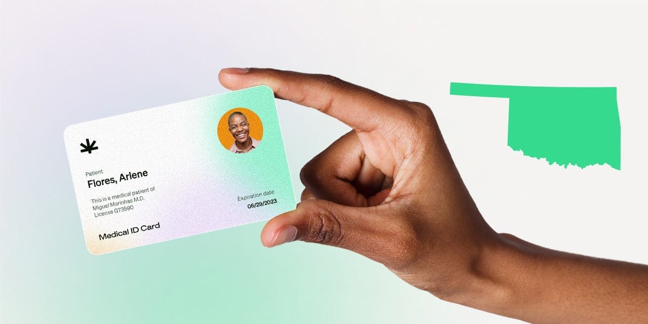 closeup hand holding MMJ card