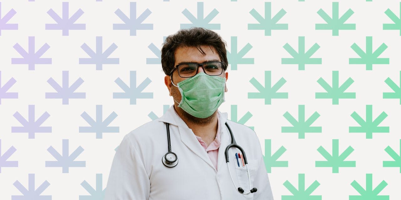 doctor wearing mask, eyeglasses and his hospital gown with stethoscope on his shoulder