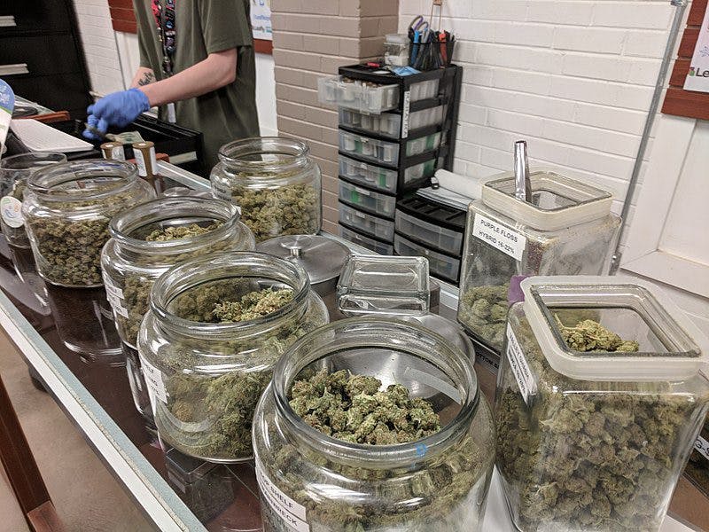 Curing cannabis in mason jars at a dispensary.