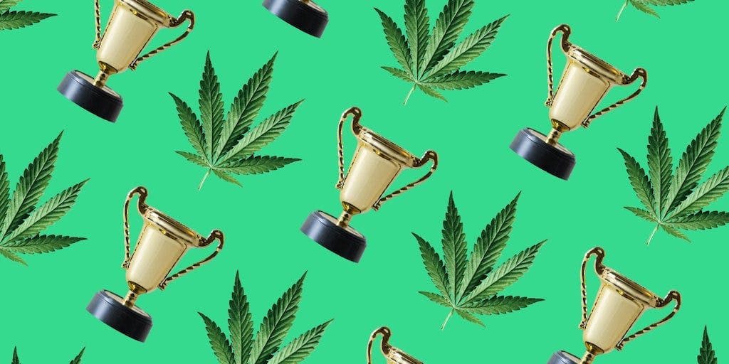 indica leaf and trophy on a green background