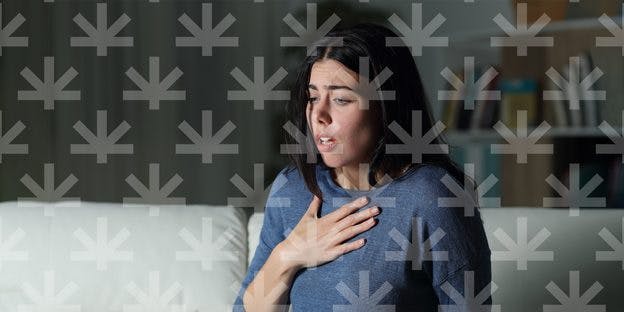 a woman with hand on chest as if it had trouble in breathing