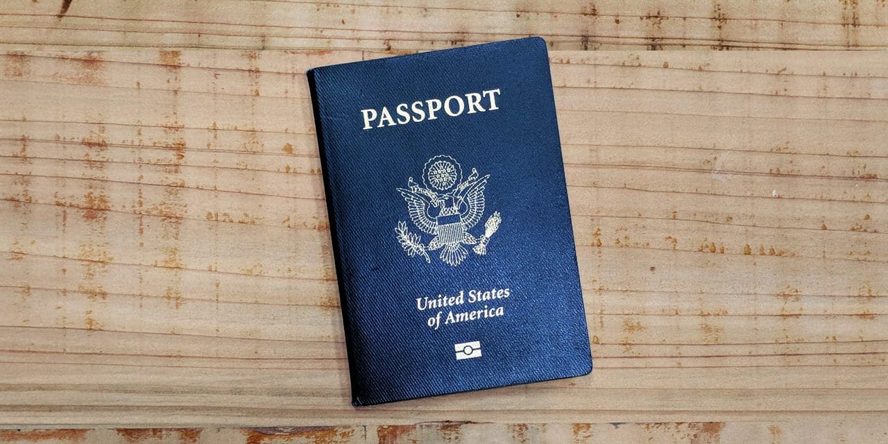 passport sitting on a wooden table