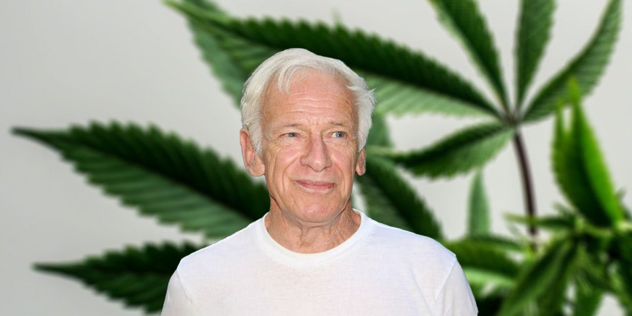 Dennis Peron with marijuana plant as background