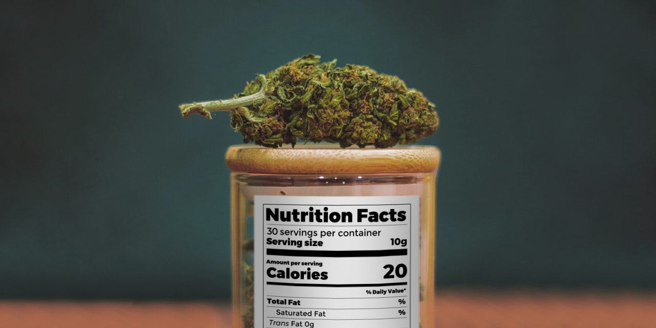 weed chunk over a container with nutrition facts label