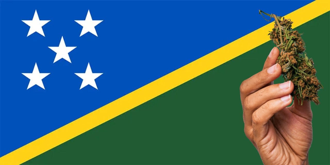 The Solomon Islands flag with a hand holding a marijuana infront of it