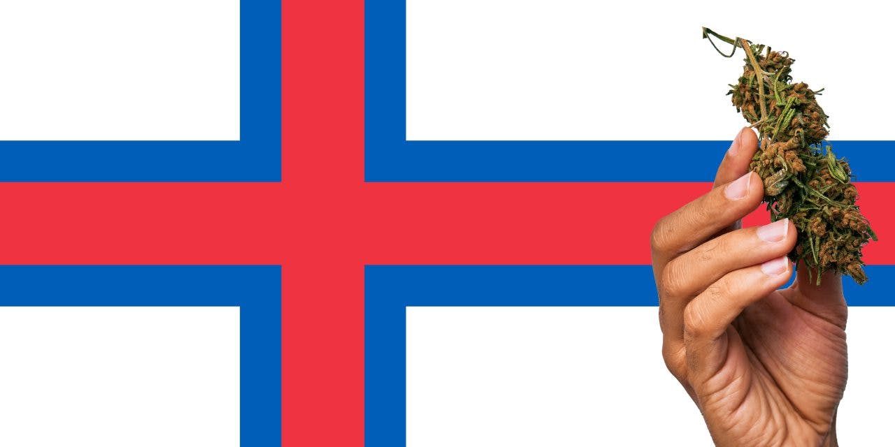 Faeroe Islands flag with a hand holding a marijuana infront of it