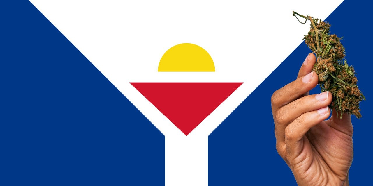 Saint Martin flag with a hand holding a marijuana infront of it