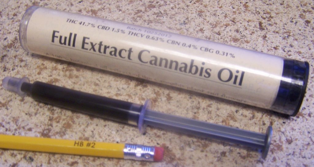 Full extract of cannabis oil (Rick Simpson Oil, RSO) in a syringe. Medication contains CBC, CBD and THC.